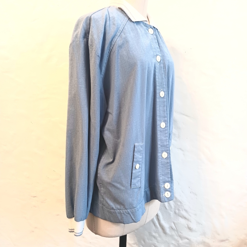 Vintage Teddi blue windbreaker with varsity stripes on cuffs and collar. XL.